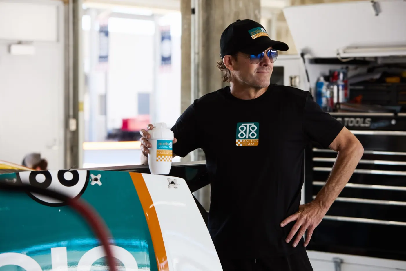 Stanton Barrett in the garage holding an 8T8 energy can