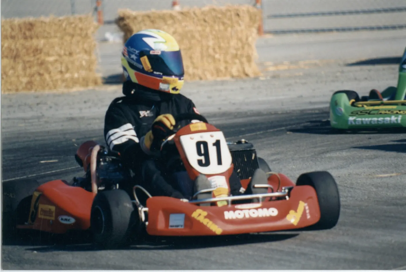 Young Stanton Barrett racing a go-kart, number 91